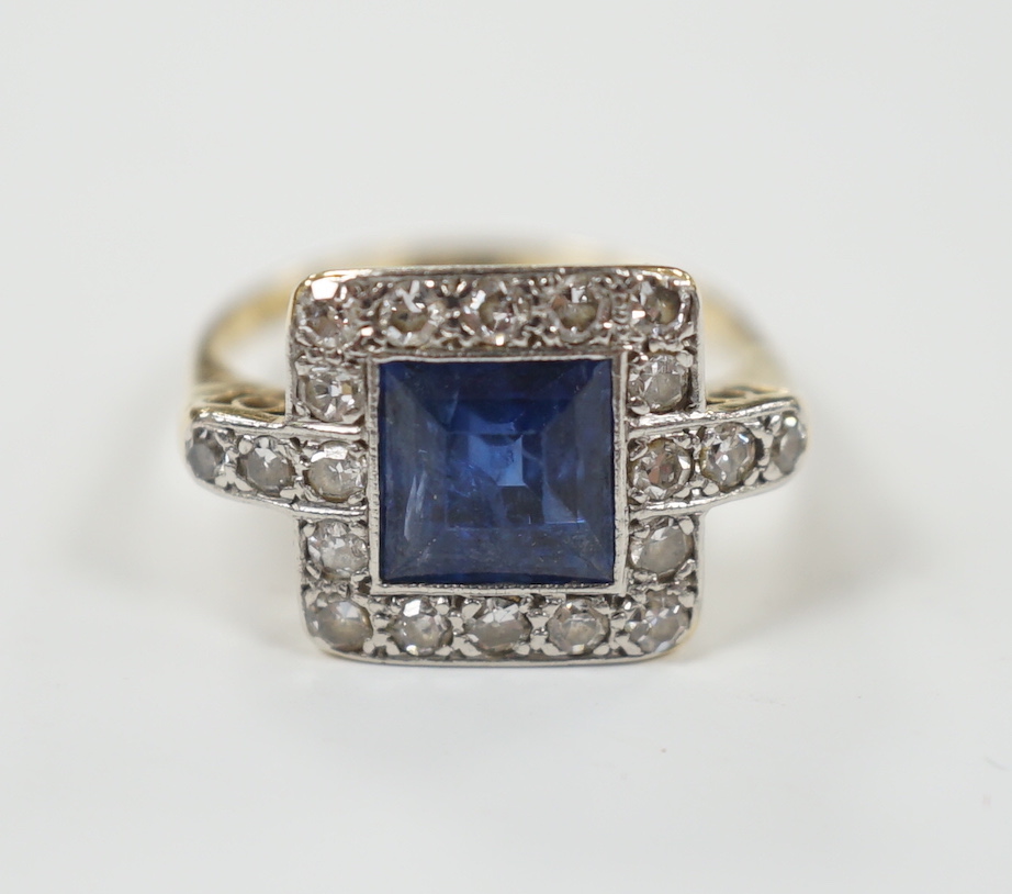 A 1940's/1950's 18ct gold & platinum, sapphire and diamond cluster set tablet ring, with diamond set shoulders, size G, gross weight 2.6 grams.